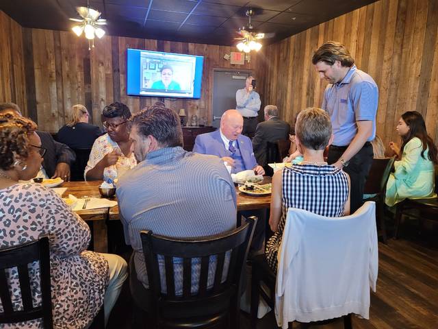 Curt Smith, a Clinton-Sampson Rotarian, serves cupcakes to the assembled members and their guests celebrating the clubs 35th year.
                                 Sherry Matthews|Sampson Independent