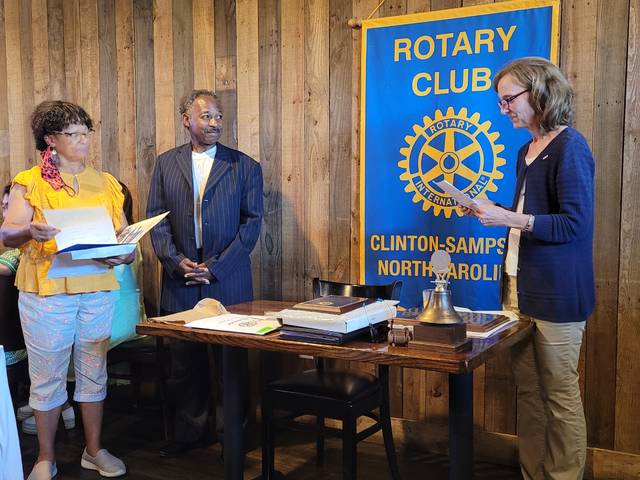 Before giving up her duties to incoming Rotary President Ron Carter, Eileen Coite, along with member Lethia Lee, installed one of the clubs newest members, Dr. Thaddeus Godwin.
                                 Sherry Matthews|Sampson Independent