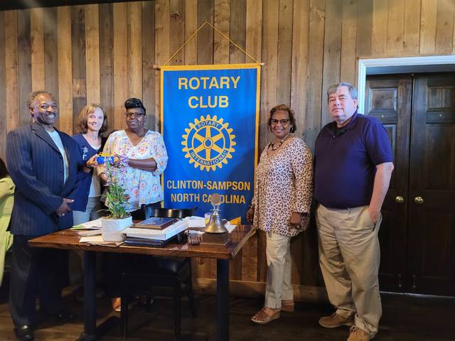 Dr. Thaddeus Godwin, pastor of Lisbon Street Missionary Baptist Church, his wife, Eloise, and Lillie Lamb, vice chairwoman of the churchs trustees, receive the Service Above Self award Monday for the church. The award is the Clinton-Sampson Rotary Clubs highest non-member honor. Rotarian Jeff Swartz, far right, and club president Eileen Coite are pictured with them as they receive the award.
                                 Sherry Matthews|Sampson Independent
