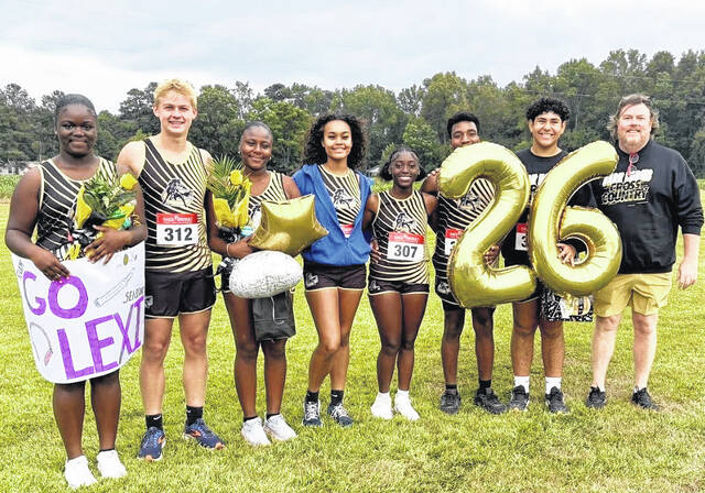 Dark Horse seniors, from left, Alexis Hemingway, Will Johnson, ShaNiya Hemingway, Giana Smith, Zadia Melvin, KaMareyon Smith, Derin Travers, and Coach Perry Gillespie.