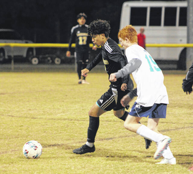 Lakewood defenseman John Carlos Fernandez dashes past a Southside player to advance during Tuesdays matchup.