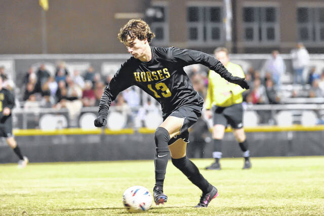 Clinton captain Holden Spell races the ball toward the Panthers goal during the second half of action.