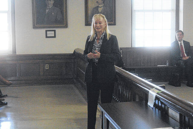 Artist Irene Bailey, who painted Ross Hollands portrait, makes statements on the process of creating the artwork.
                                 Photos by Noah Britt | Sampson Independent