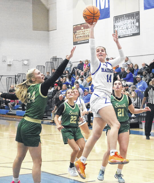 Peyton Herring shoots a floater in the lane against the Lady Trojans in Wednesdays loss.