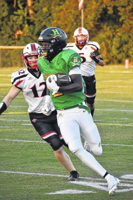 Crusader Jeremiah Davis breaks around the corner on the first snap in a game earlier this year against North Wake, picking up over 30 yards on the play.