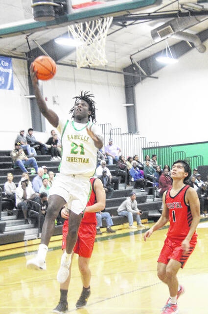 Junior forward Jeremiah Davis goes for a layup after a successful fast break for the Crusaders.