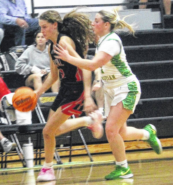 Coastal Christians Evie Munroe pushes the break, leading her squad to a successful victory during Tuesdays night contest with Harrells.