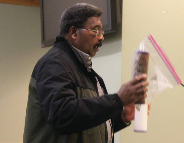 Charles Royal of Roseboro also addressed the Sampson County Board of Commissioners about dirty water in his community, showing a rust-colored water filter, compared to a clean, new filter.
                                 Abby Cavenaugh | Sampson Independent