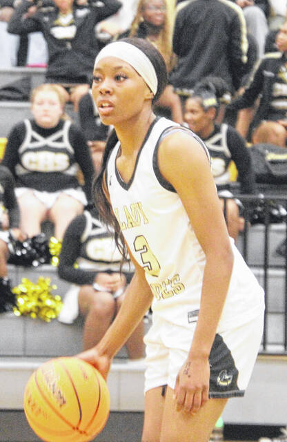 Lady Dark Horse Ciara Stuart scans the court as she tries to find an open teammate.