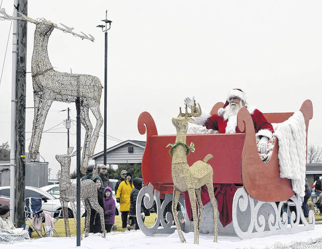 It might have been cold and a bit misty Saturday throughout Sampson County, but it didnt stop Newton Grove from kicking off Christmas in grand style with its annual parade, which drew a bundled up crowd to the circle and parts of the downtown to watch the colorful floats sweep through town. Pictured, a Dunn Clown gives a youngster a fist bump while the Grinch steals a fist bump; the Hobbton High Band plays some holiday music for the crowd; the Sudan Street Racers delight parade-goers and, of course, Santa makes his appearance as the parade closes out.