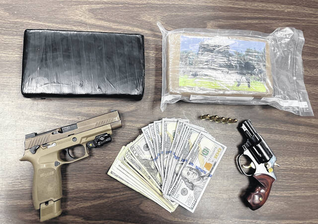 Some two kilograms of cocaine, firearms and an undisclosed amount of cash was confiscated during a traffic stop near Wrye Branch Road Dec. 5, leading to the arrest of two Sampson men on felony drug charges.