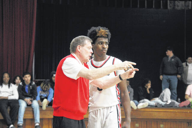 Union head coach Randy Jordan breaks down looks for senior Manny Adams.