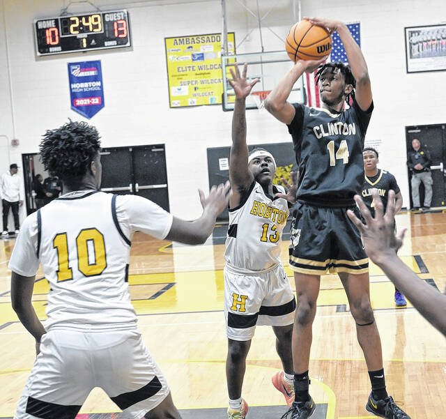 Senior Dark Horse Taylen Moore rises up for a contested jump shot in the opening minutes of Fridays victory.