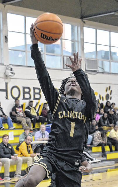 Clinton sophomore Romello Causey finishes for an easy bucket during Fridays JV contest.