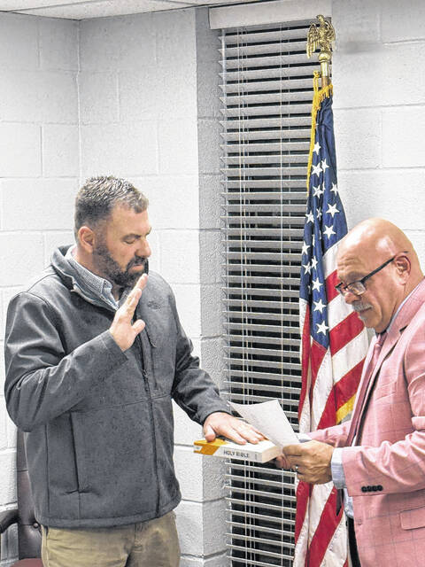 New chairman of the planning board, Chancey Phillips, is sworn in to his new position by Mayor Ralph Smith Jr.
Trevon McGlone| Sampson Independent