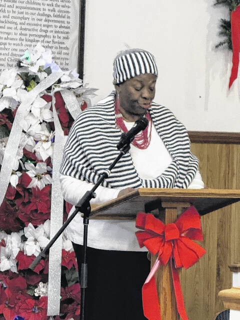A member of the Lisbon Street Missionary Baptist Churchs program committee, Sister Peggy Devane addresses a crowd of around 50	The Proclamation for Us portion of the Wednesday night Watch Night Service.
                                 Trevon McGlone| Sampson Independent