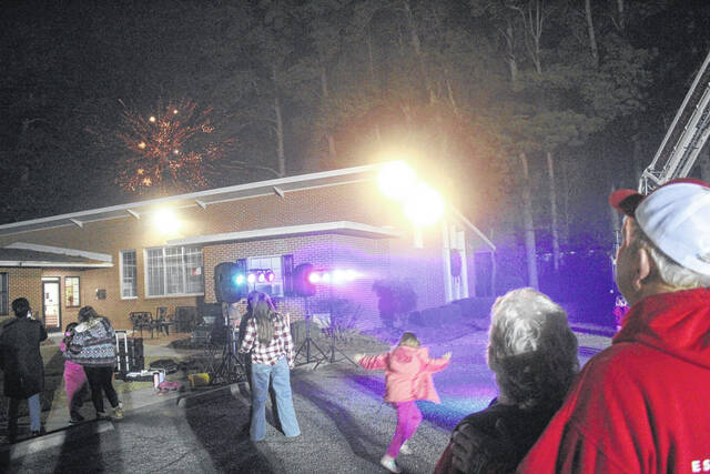 The Warrens stand together to see the fireworks.
                                 Photos by Noah Britt | Sampson Independent