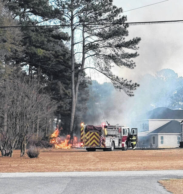 A grass fire on Sunday afternoon threatened several homes and other structures on Underwood Street in Clinton.
                                 Courtesy photo | Justin Byrd