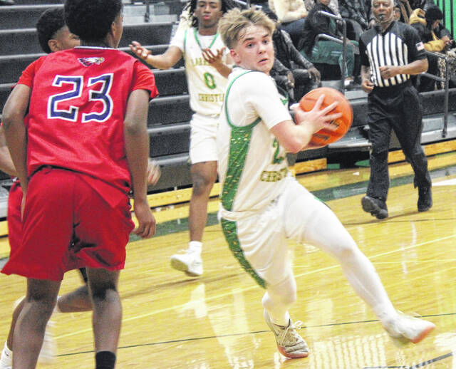 Senior forward Collin Cole drives through traffic to get to the paint for a scoring attempt.