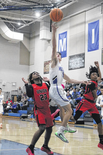 Sophomore Raider guard Ace Matthews elevates for an acrobatic layup against the defending Spartans on Friday.