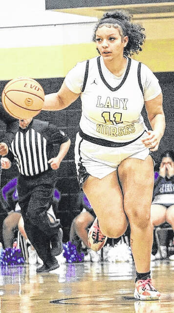 Jianna Pickett pushes the break for the Lady Dark Horses as they cruised in their win.