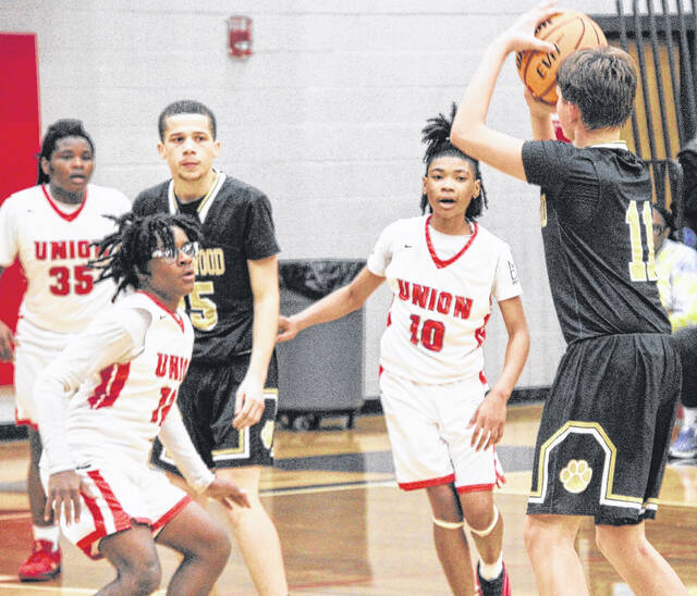 Lakewoods Chance Sessoms launches a three against the JV Spartans in Thursday nights bout.