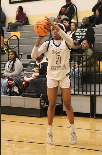 Senior Lady Dark Horse launches a corner shot to help lead her squad to a victory.