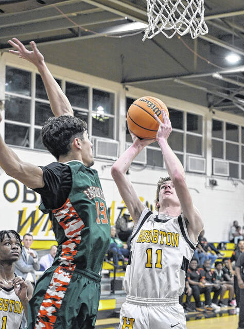 Senior Wildcats Lathan Warren drops a floater over an East Columbus defender.