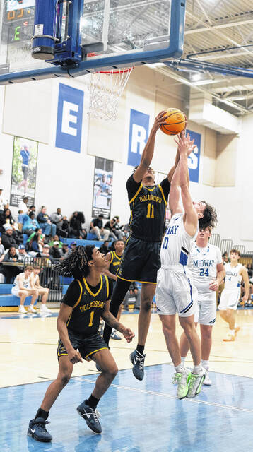 Midway sophomore Ace Matthews elevates and attempts to grab a rebound during Fridays contest.
                                 Courtesy photos | Samantha Edwards