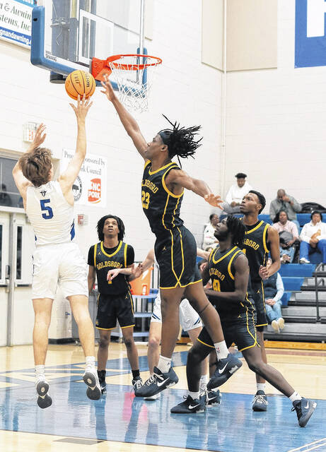 Cougar big man Jabrion Bynum-Armstrong denies a shot from Midway senior Camden Wilson.
                                 Courtesy photos | Samantha Edwards