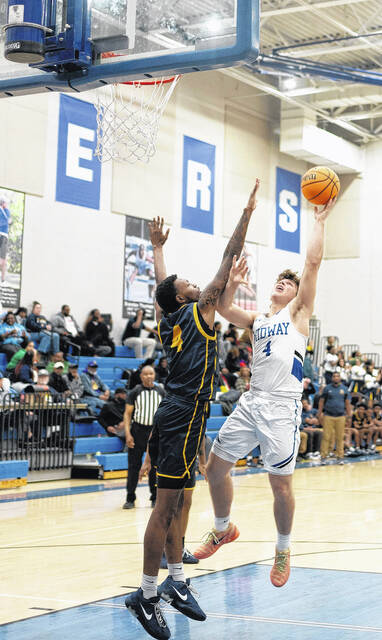 Junior Raider Tanner Williams drops a floater over a defender from Goldsboro.
                                 Courtesy photos | Samantha Edwards