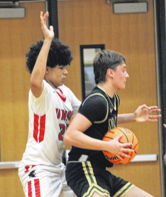 Spartan big man Maliq Dominguez battles against North Duplin captain Jackson Lee down in the post.