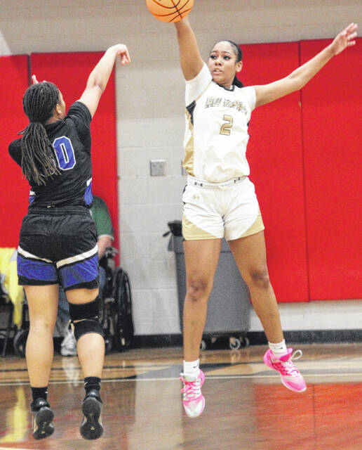 Lakewood sophomore Takiyah Carr gets a well-timed block against senior Lady Eagle Nia McKoy.