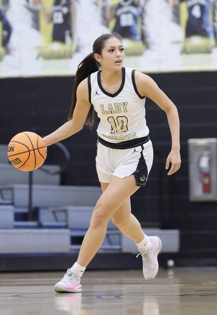 Clinton junior Ruby Davila keeps her eyes up the court pushing a fast break attempt.