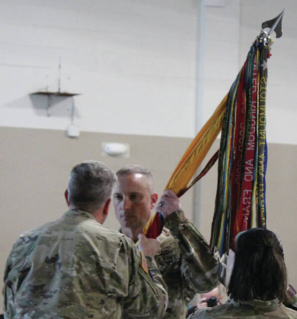 Brigadier Gen. Wes Morrison, assistant adjutant general of the NC National Guard, presided over Saturdays ceremony, passing the units flag to Col. Ben Wynn.
                                 Photos by Abby Cavenaugh | Sampson Independent