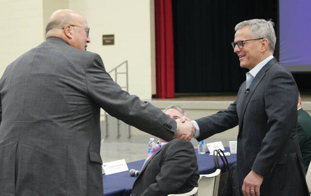 Sampson Community College President Dr. Bill Starling, left, shakes hands with Gov. Josh Stein before the start of the governors rural listening session.
Abby Cavenaugh | Sampson Independent