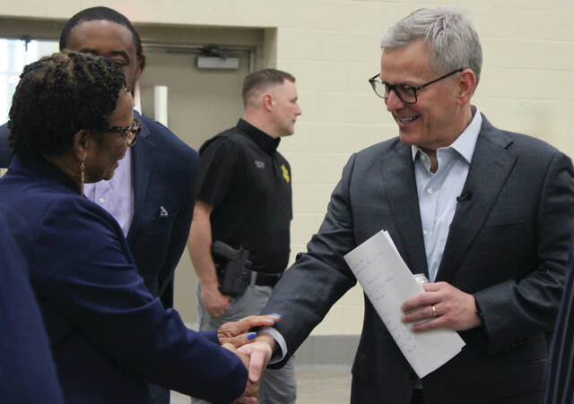 Dist. 4 Commissioner Lethia Lee, left, shakes hands with Gov. Josh Stein on Wednesday. Sampson County Sheriffs Office Captain Marcus Smith, in the background, was also part of the panel for the governors rural listening session.
Abby Cavenaugh | Sampson Independent