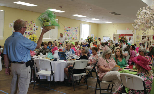 Tims Gift hosted its eighth Tea Party Saturday at First Methodist Church in Clinton. Each year, the nonprofit organization provides tea, refreshments and gift baskets as auction items in order to help raise money for the ministry. See more photos from this years event in Wednesdays print edition.
                                 Abby Cavenaugh | Sampson Independent
