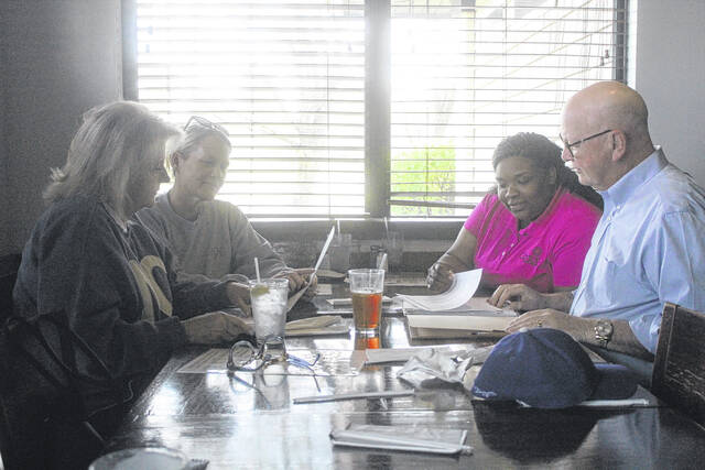 Organizers for the event, including Bill Scott and Debbie Roberts, Main Street manager Tyler Wise and marketing specialist Meredith Horne met up at Ribeyes Steakhouse Monday morning to celebrate the events success.
Noah Britt | Sampson Independent
