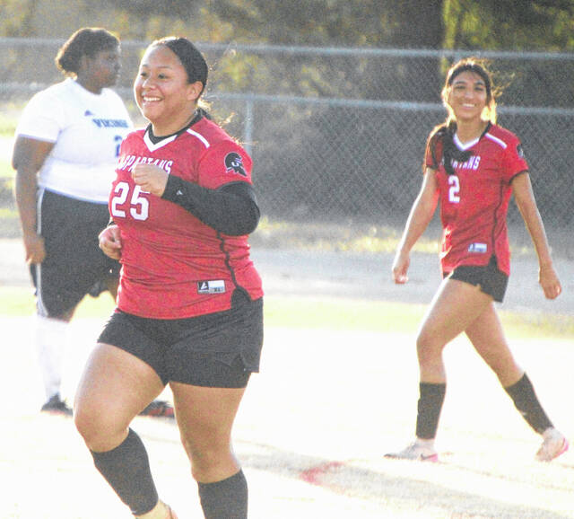 Union sophomore Angelica Vega (25), along with teammate Iveth Garcia, heads back to midfield with joy after Vega scores her first goal of the season.