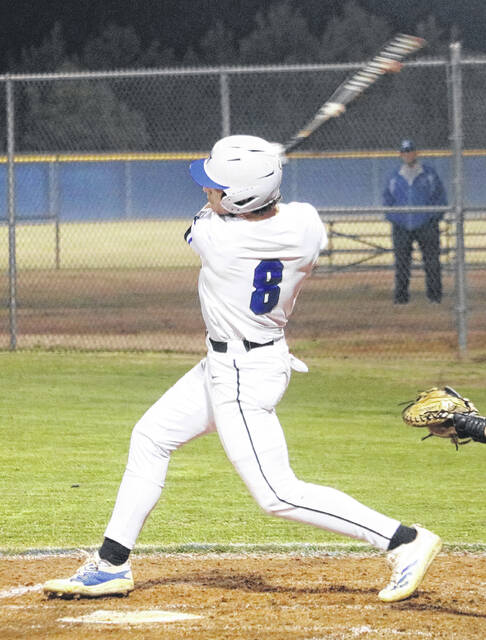 Midway junior Tanner Williams connects and sends a ball to right field.