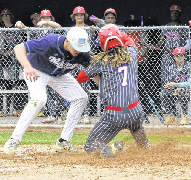 Penders Darius Bowen scores after West Columbus pitcher loses the ball on a steal home.