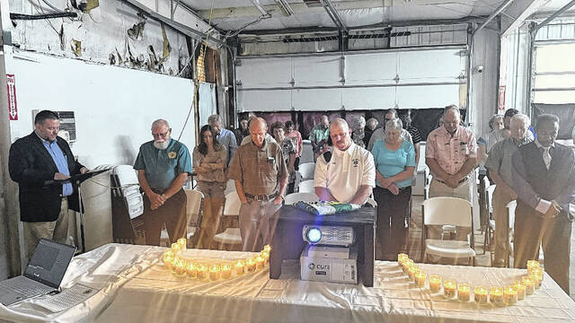 Suttontown Emergency Medical Services and attendees hold a moment of remembrance for former Suttontown EMS members that had passed during the memorial portion of the volunteer departments 50th anniversary celebration on Sunday afternoon. Suttontown EMS was founded in 1976.
Trevon McGlone| Sampson Independent
