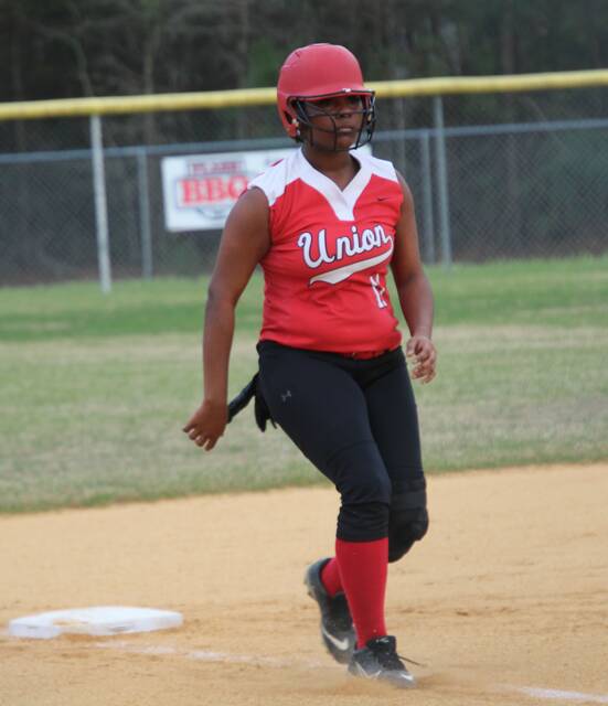 Senior Lady Spartan Saniya Maynor advances to third base with her eyes on the home plate.
A. Goodman | Sampson Independent