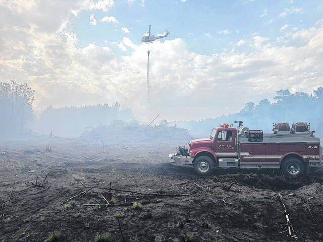 Smoky conditions are expected to persist in the Halls Fire District, due to a woods fire Monday on Share Cake Road. Halls and Vanns Crossroads firefighters battled the blaze throughout Monday afternoon and night, along with help from the NC Forest Service.
Courtesy photo | Halls Fire & Rescue