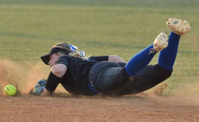 Midway shortstop Ella Clark extends to knock down a hard-hit ball, limiting the Goldsboro batter to an infield single.