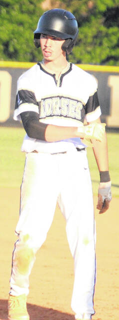 Clinton senior Roady Carter makes his way back to first base safely in Tuesdays win.