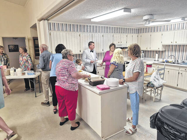 As the Mothers Day event begins at Carr Memorial Church, the kitchen begins to get more crowded