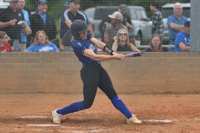 Midway junior Kyleigh Stonerock slams a fourth-inning double for the Lady Raiders.