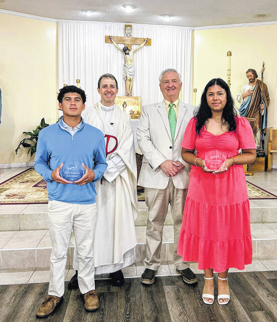 From left, Dylan Zuniga, Father Brian Vaccaro, Michael Mozingo, and Katherine Solis-Diaz following the awarding of the 24th annual Edith Bradshaw scholarships May 10. In total, Mozingo has awarded over $30,000 in scholarships since 2003.